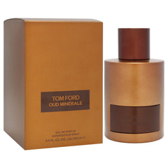 Tom Ford Oud Minerale cap closeup emphasizes premium craftsmanship and refined scent signaling.