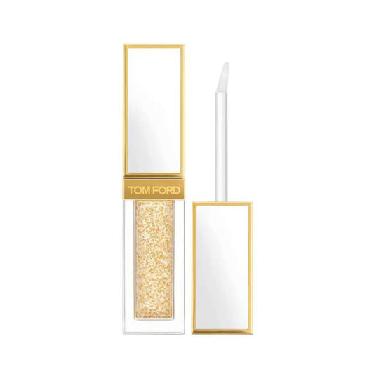 Tom Ford Soleil Soleil Liquid Lip Blush Clear with gold flakes enhances lips with shine and pink-tinted glow.