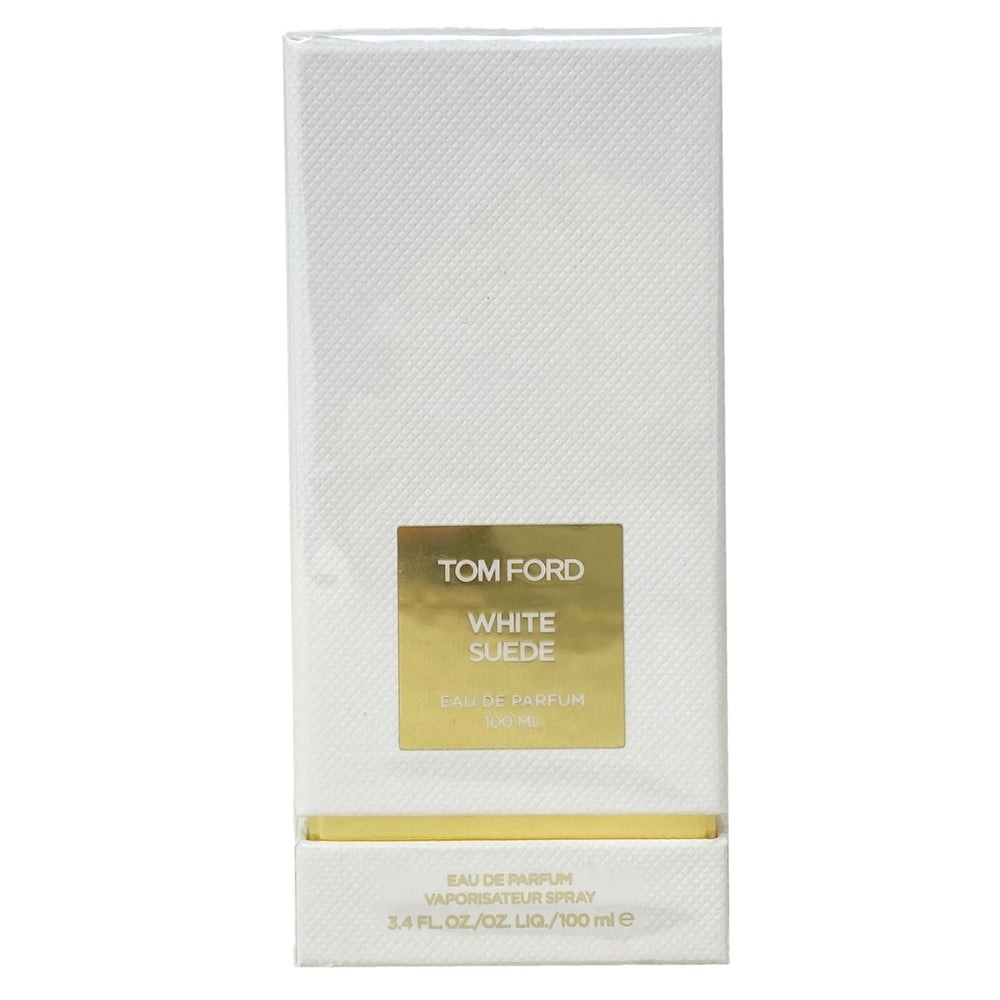 Tom Ford White Suede EDP bottle pour, emphasizing long-lasting, musk-forward fragrance for daily elegance.