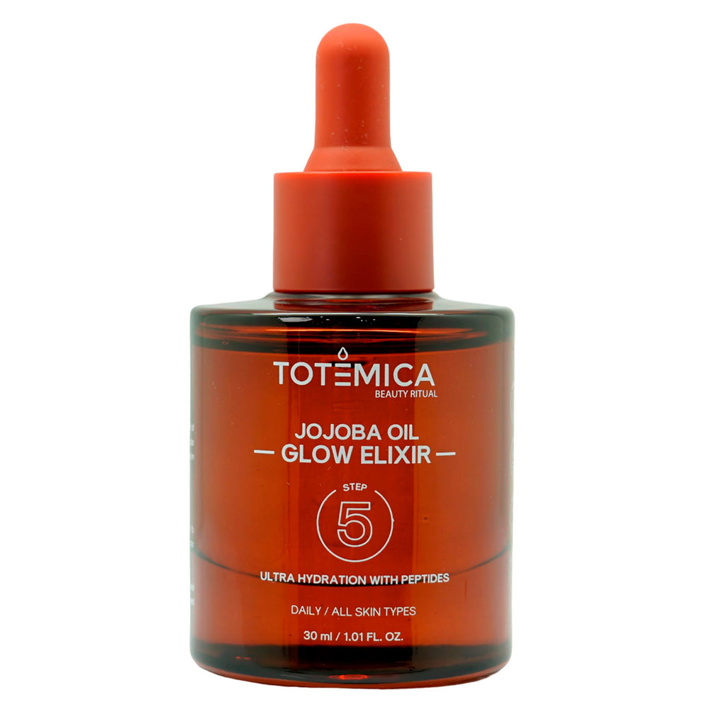 TOTEMICA Jojoba Oil Glow Elixir bottle close-up for hydration and radiance.