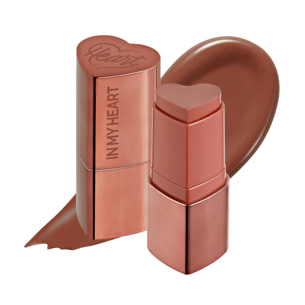 Touch in Sol In My Heart Stick Blush swatch on cheek for dewy color