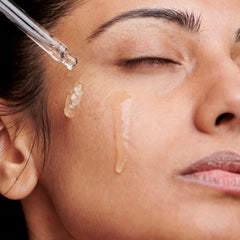 Touch of Mink bottle on shelf; premium skincare presentation with a glossy finish