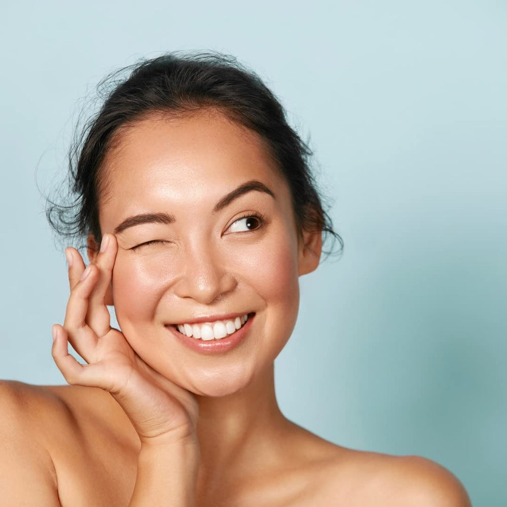 Touch of Mink hands applying oil; demonstrates quick absorption and light barrier