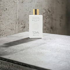Close-up texture of Tova Signature Body Velvet Lotion reveals creamy richness and a smooth finish.