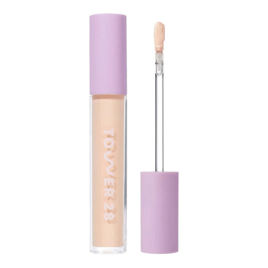 Tower 28 Swipe Serum Concealer close-up applying smooth, hydrated coverage