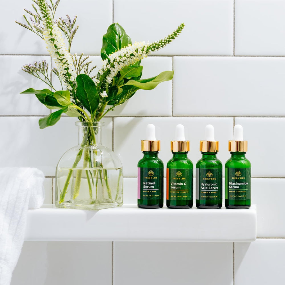Tree of Life Beauty Serum drops being applied for daily care.