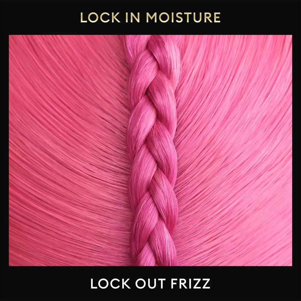 Applying mousse to damp hair, prepping for shaping and hold.