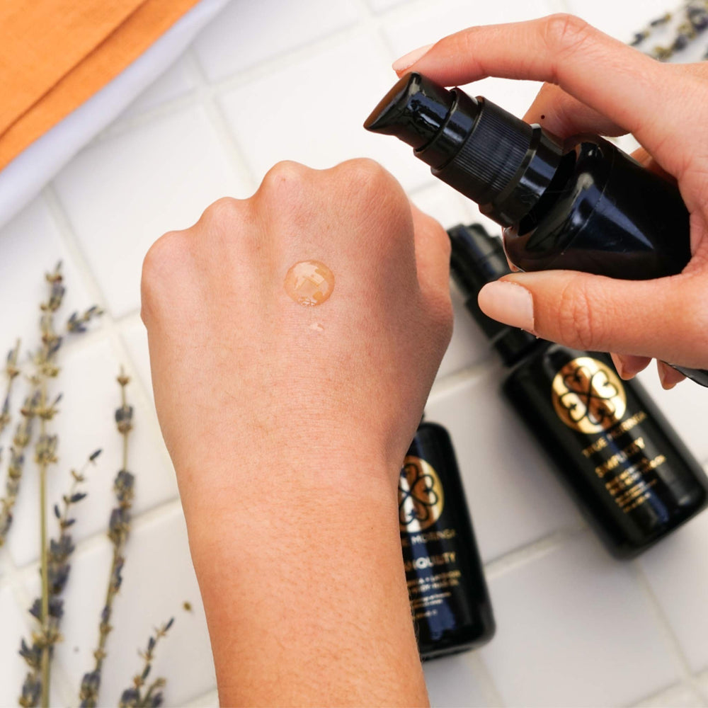 True Moringa Oil bottle pour shows easy blending into serums.