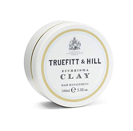 Truefitt & Hill Euchrisma Clay packaging on a vanity for premium grooming.