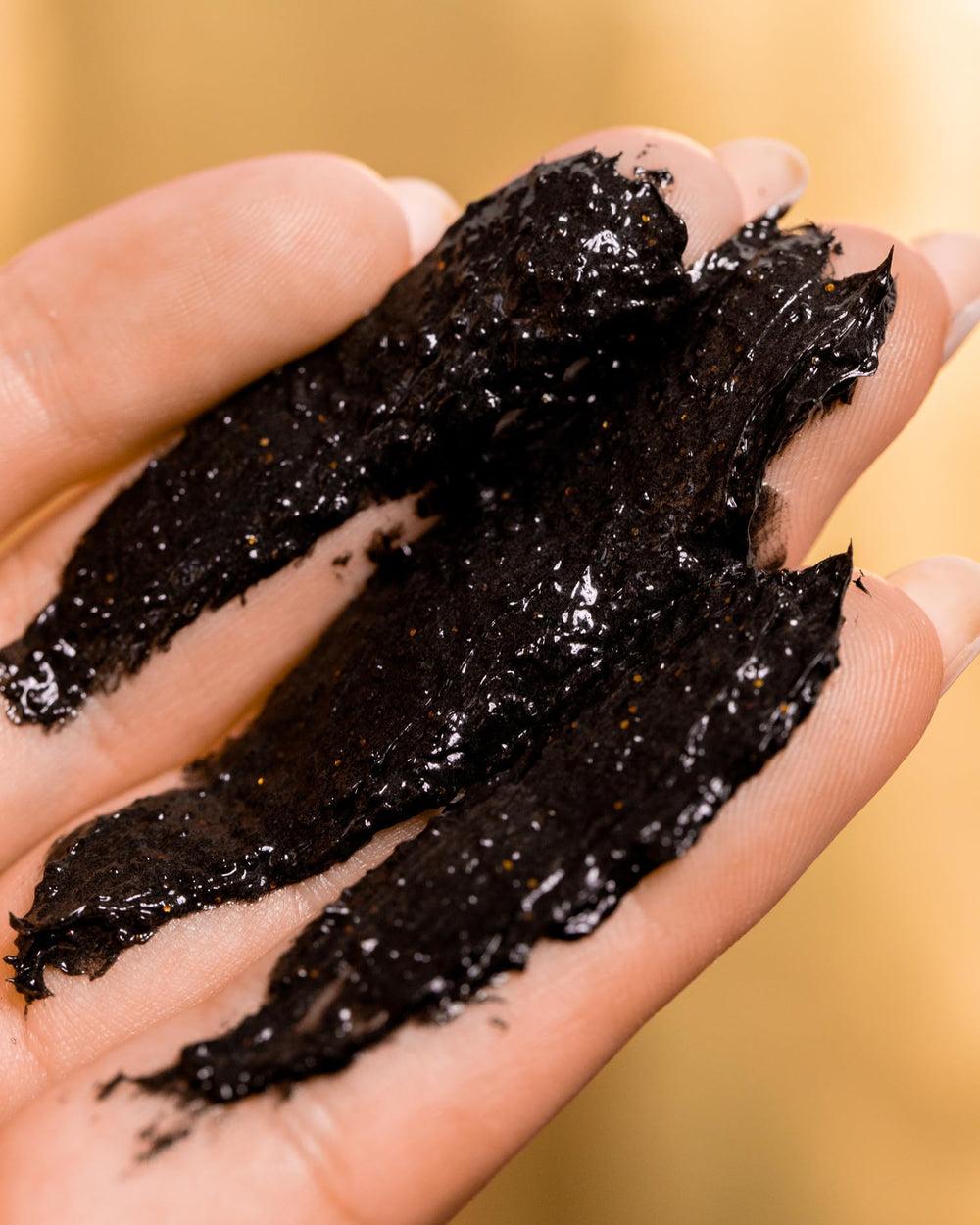 Truly 24K Gold Black Soap gold flakes detail suggest premium glow and luxury.