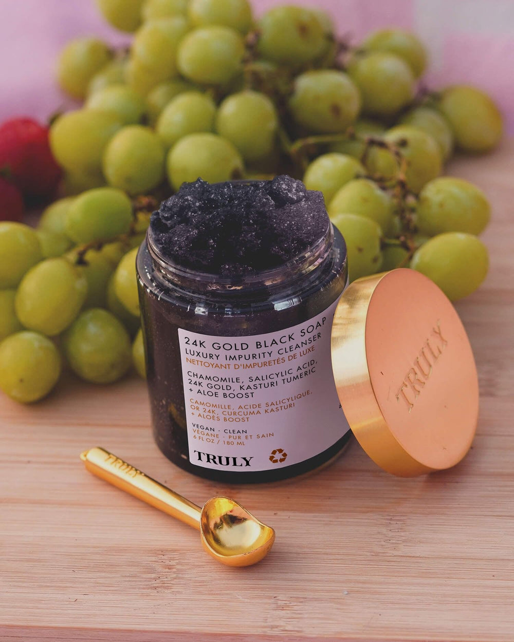 Truly 24K Gold Black Soap texture close-up showing rich exfoliating feel.