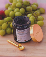 Truly 24K Gold Black Soap texture close-up showing rich exfoliating feel.