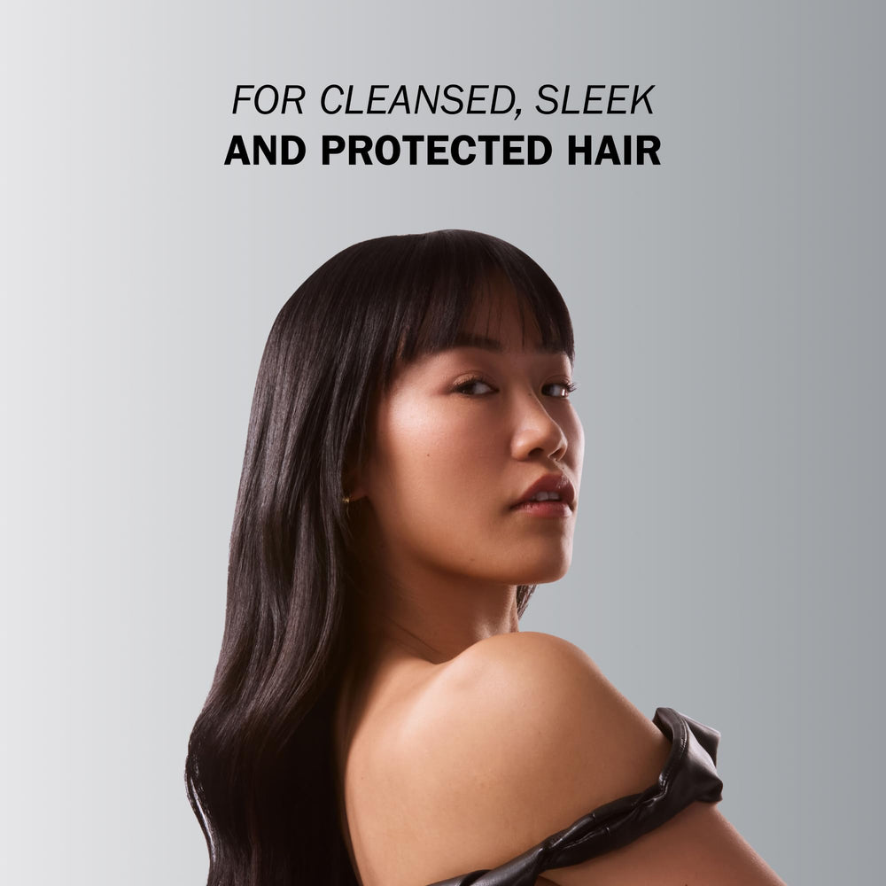 TRUSS Frizz Zero Shampoo hands applying product to frizzy hair for control