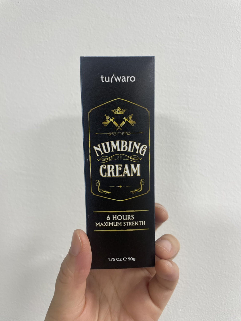 Tuiwaro numbing cream bottle for skin, soothing relief during treatments.