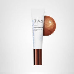 TULA Bronze Boost Glow on sunlit skin for a radiant look.