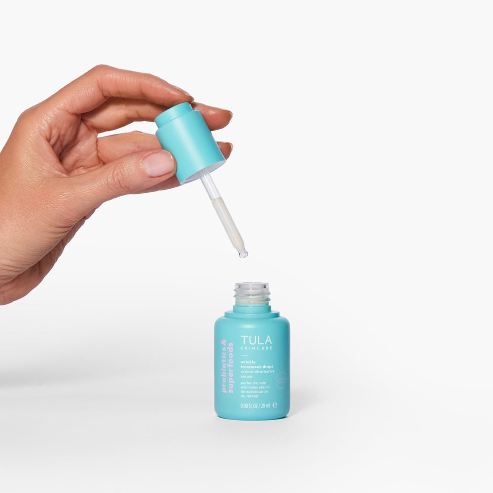 TULA Wrinkle Treatment Drops massaged into skin to help smooth appearance