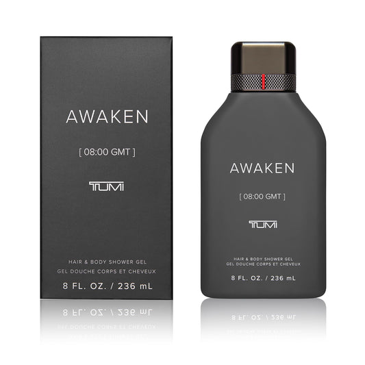 TUMI Awaken shower gel bottle with pour detail, energizing start to your day.