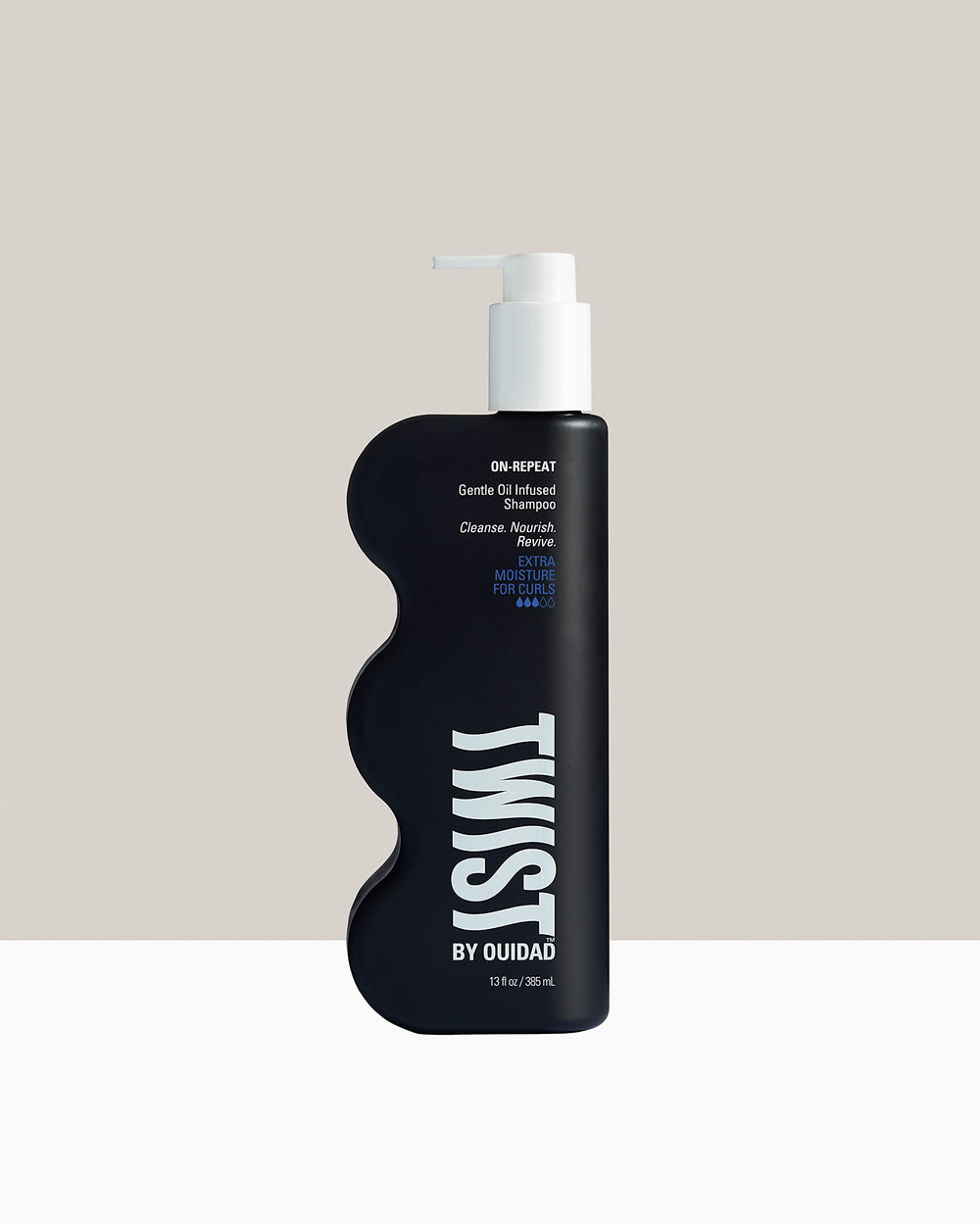 TWIST On-repeat shampoo on curls showing soft definition and moisture