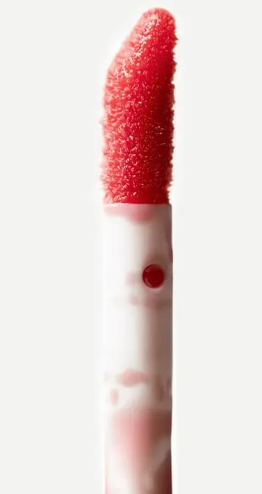 Typology lip oil gloss finish on lips with non sticky shine.