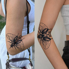 UBICA Tattoo Tech beetle wing close-up, bold black ink for wrist art.