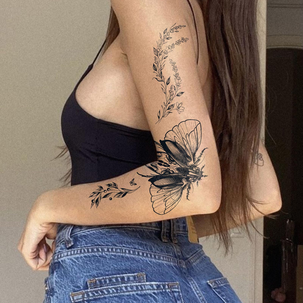 UBICA Tattoo Tech branch motif on wrist, realistic insect-inspired body art.