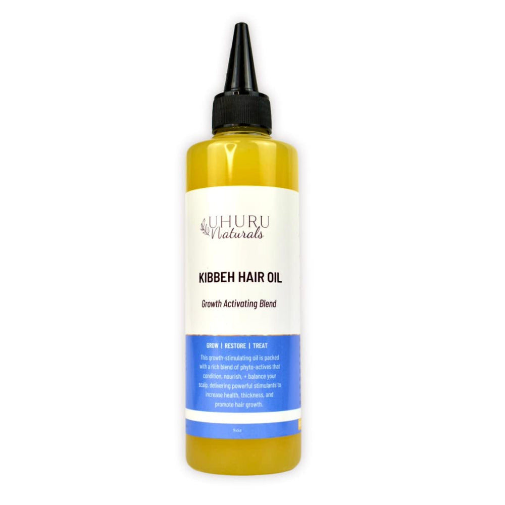 Uhuru Naturals Kibbeh Hair Growth Oil bottle pour; nourishes scalp and supports stronger, fuller hair.