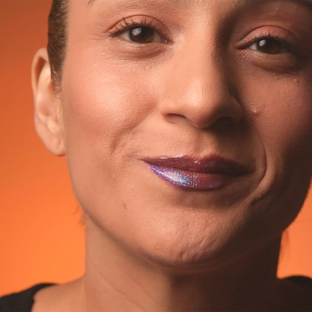 Unicorn Snot Glitter Boss lip swatch showing holographic shimmer on skin.