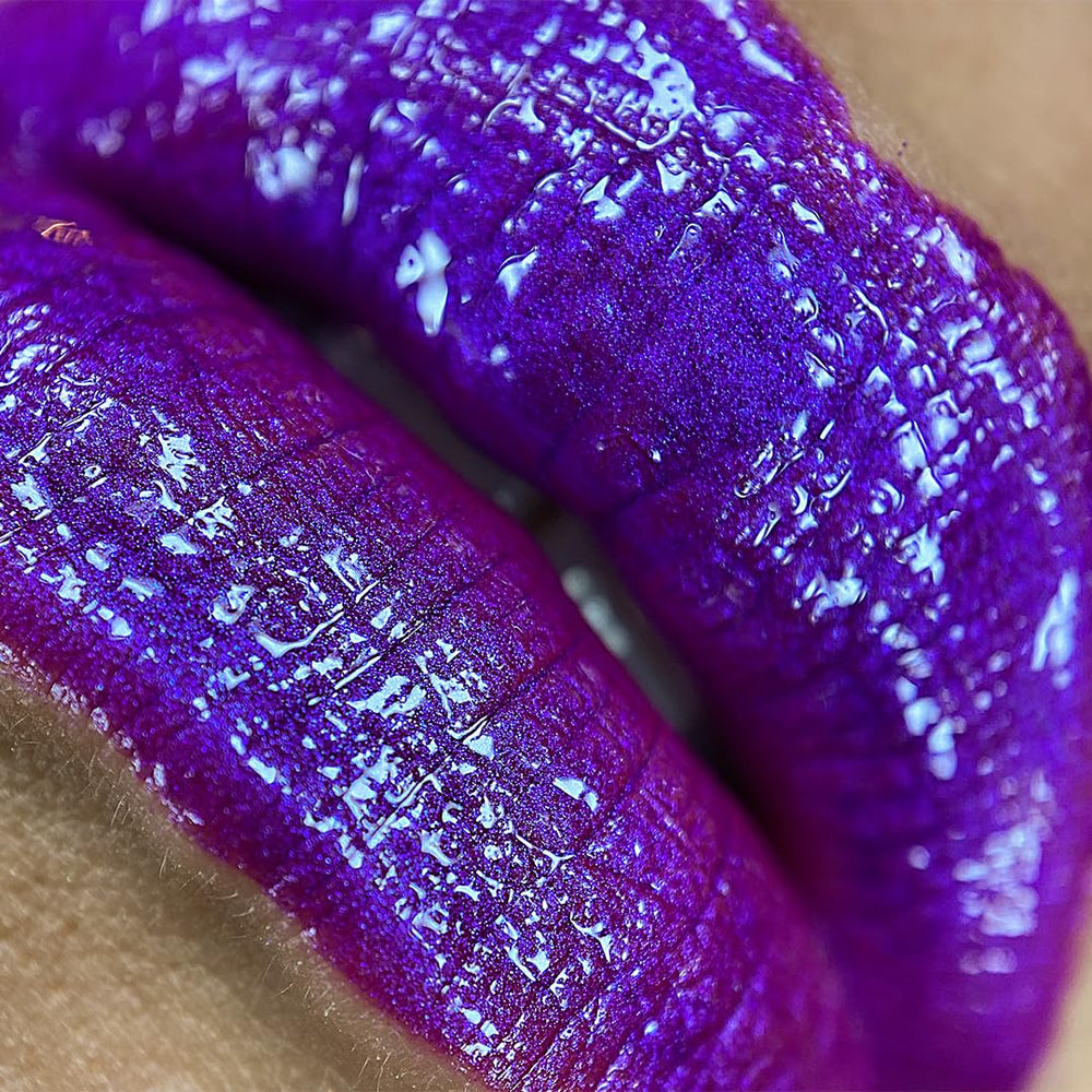 UNICORN SNOT Liquid Metal Lip Paint GLOW swatch showing shimmering pigment