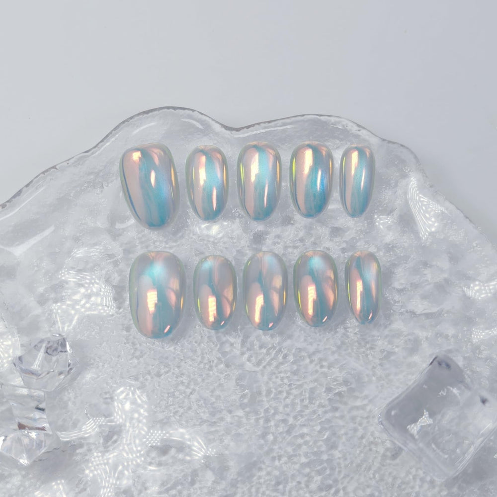 Uniyvoh cat eye nails with glitter and sequins catching light