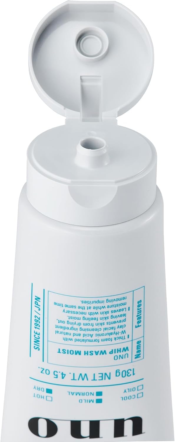 UNO WHIP WASH exfoliating beads visible, helping clarify pores.