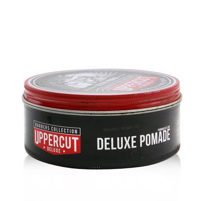 Uppercut Deluxe Deluxe Pomade paired with CT5 Comb for precise shaping.