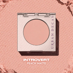 Urban Decay 24/7 Eyeshadow Single Introvert Peach Matte swatches reveal soft wearable peach tones
