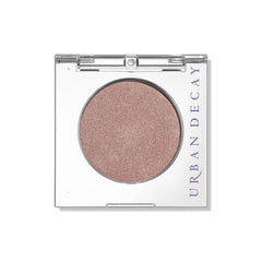 Urban Decay 24/7 Eyeshadow Single in Sin swatch showing champagne shimmer for a soft daytime glow