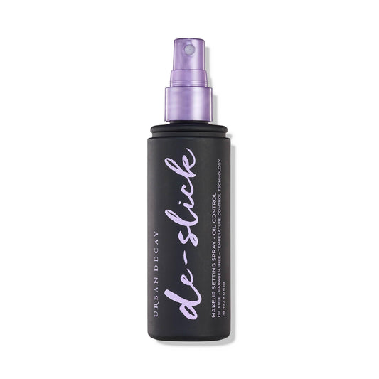 Urban Decay De-Slick bottle with matte spray for all-day oil control.