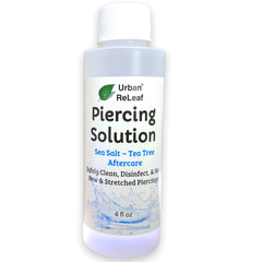 Urban ReLeaf Piercing Solution bottle closeup for soothing aftercare