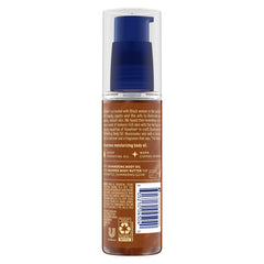 Vaseline Illuminate Me shimmering oil applied for an even radiant glow.
