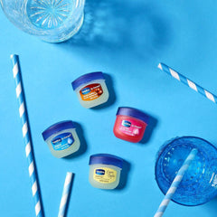 Backlit shot of Vaseline Cocoa Butter packaging highlighting portability.