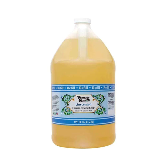 VERMONT SOAP Organics foaming hand soap dispensing in a clean bathroom.