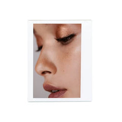 Victoria Beckham Beauty Lid Lustre Honey close-up swatch shows wet pearlescent glow.