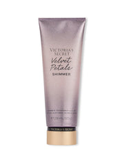 Victoria's Secret Velvet Petals Shimmer lotion bottle showing silky texture and glow.