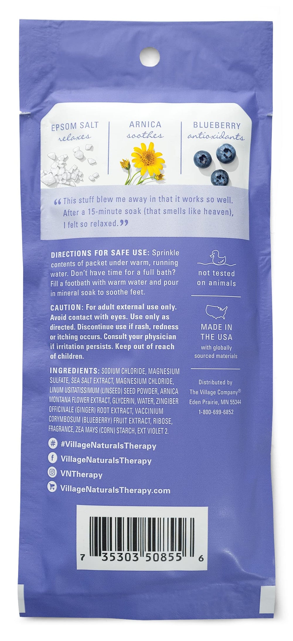 Village Naturals Therapy soak packet dissolving in warm water for relaxation.