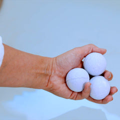 Vitabath Bath Fizzies Lavender Chamomile fizzing action in tub.