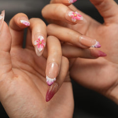 Vlazryk floral embossed French tip nails for sophisticated styling