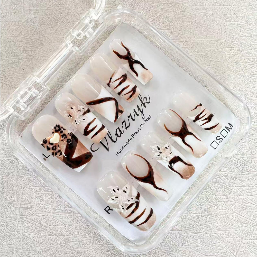 Vlazryk long-square mid-length nails with a sleek French tip for everyday style.
