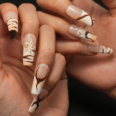 Vlazryk 3D flower embossed design nails for a delicate, elevated manicure.