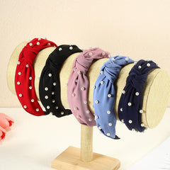 VOCOSTE headband worn during yoga and social occasions alike for subtle polish.