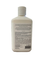 Voir Haircare Hyaluronic Acid Shampoo bottle beside natural botanicals communicates clean formula