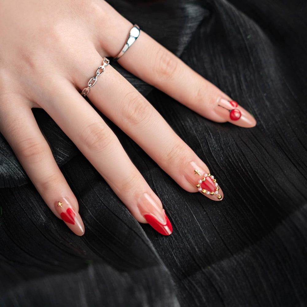 Vopintpy nails feature gold star shine and pearl accents for a glam date-night look