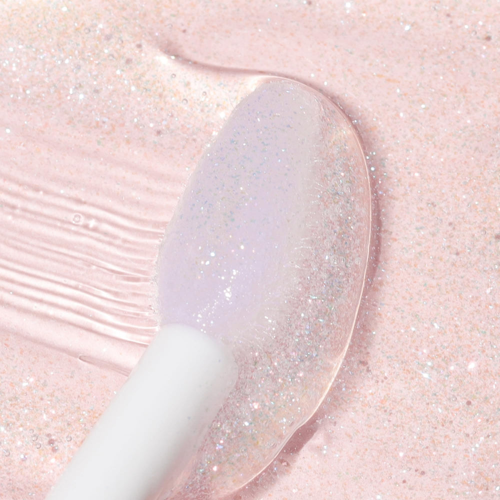 Wander Beauty Lip Retreat Oil Oasis Glow applicator swatch showing a glossy tint