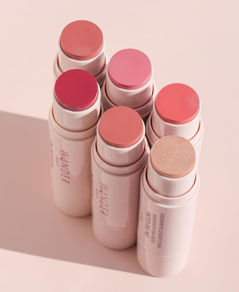 Wander Beauty On-the-Glow arm-swatch demonstrating sheer color and glow.